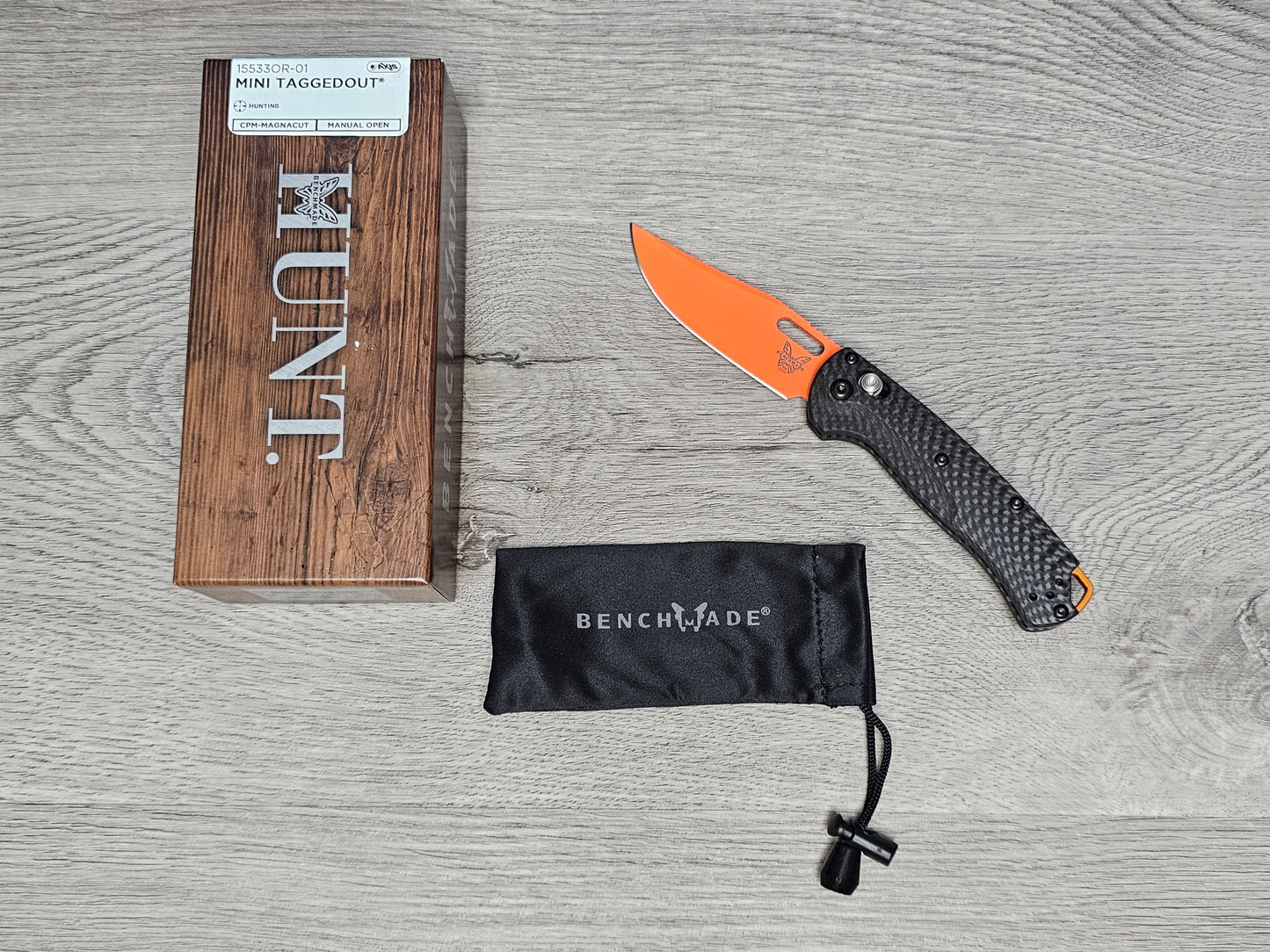 B-USA 15533or-01 M*NI TAGGED OUT CARBON FIBER W/ ORANGEBLADE KNIFE. MADE on a BENCH in Oregon