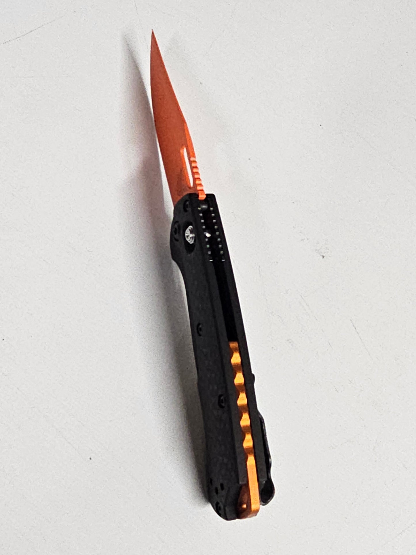 B-USA 15533or-01 M*NI TAGGED OUT CARBON FIBER W/ ORANGEBLADE KNIFE. MADE on a BENCH in Oregon