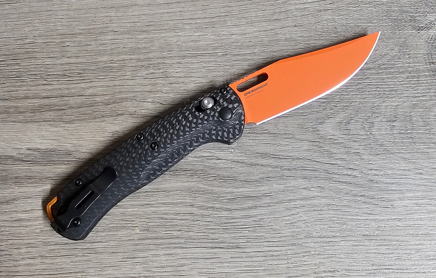 B-USA 15535or-01 TAG*ED OUT CARBON FIBER W/ ORANGEBLADE KNIFE. MADE on a BENCH in Oregon