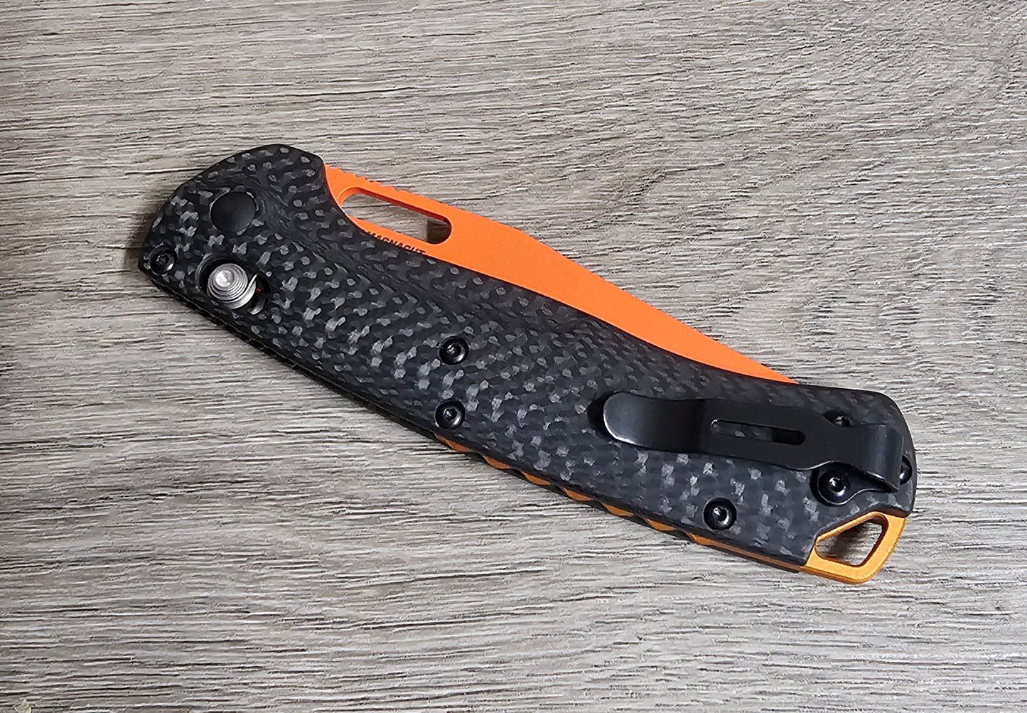B-USA 15535or-01 TAG*ED OUT CARBON FIBER W/ ORANGEBLADE KNIFE. MADE on a BENCH in Oregon