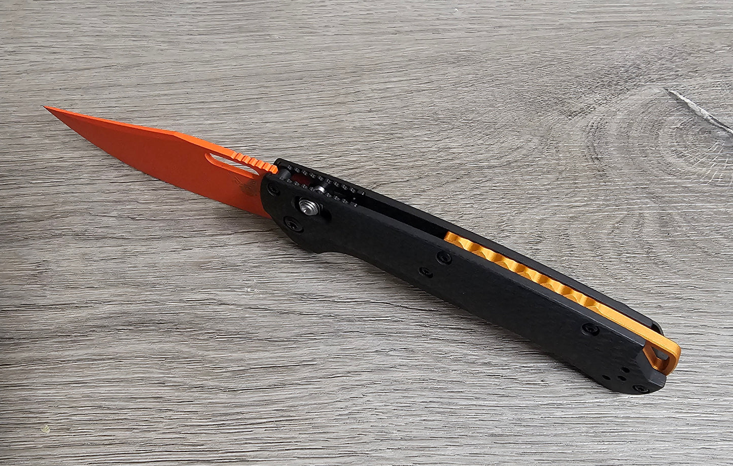 B-USA 15535or-01 TAG*ED OUT CARBON FIBER W/ ORANGEBLADE KNIFE. MADE on a BENCH in Oregon