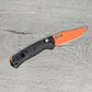 B-USA 15533or-01 M*NI TAGGED OUT CARBON FIBER W/ ORANGEBLADE KNIFE. MADE on a BENCH in Oregon