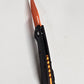 B-USA 15533or-01 M*NI TAGGED OUT CARBON FIBER W/ ORANGEBLADE KNIFE. MADE on a BENCH in Oregon