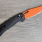 B-USA 15535or-01  TAG*ED OUT CARBON FIBER W/ ORANGEBLADE KNIFE. MADE on a BENCH in Oregon