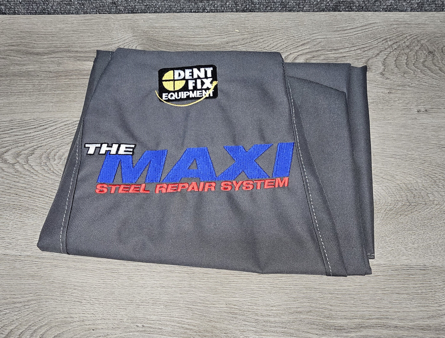 DENT FIX DUST COVER FOR MAXI AND STAND. BRAND NEW ONLY TIME OUT OF PACKAGE WAS FOR PHOTO